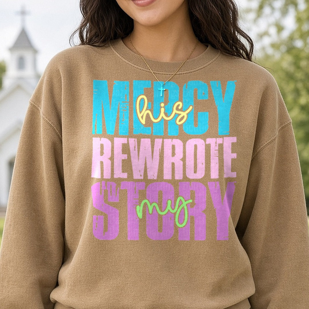 His Mercy Rewrote My Story Script Accents Bold Letters DTF transfer shown on a Comfort Colors sweatshirt