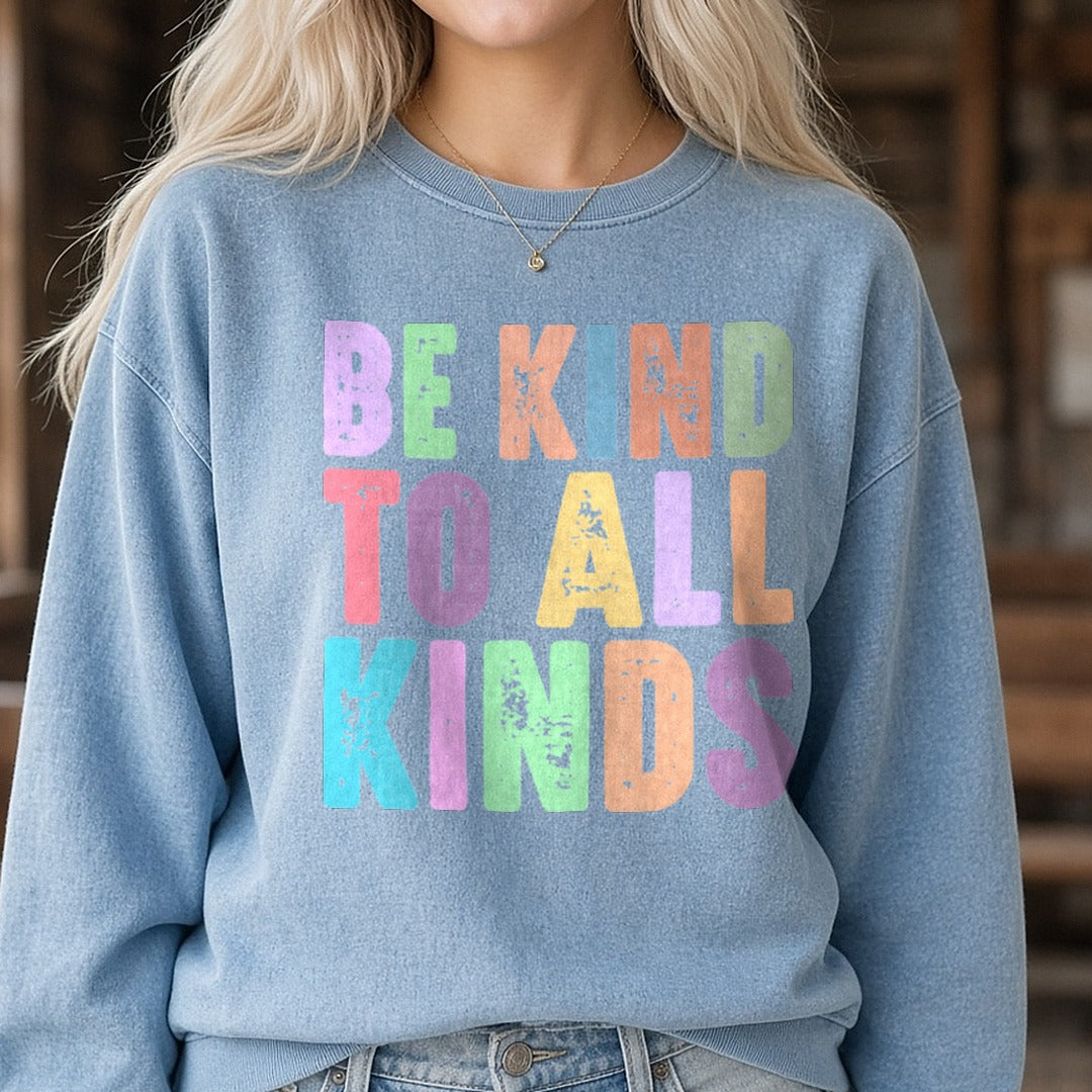 Be Kind to All Kinds DTF transfer shown on a Comfort Colors sweatshirt