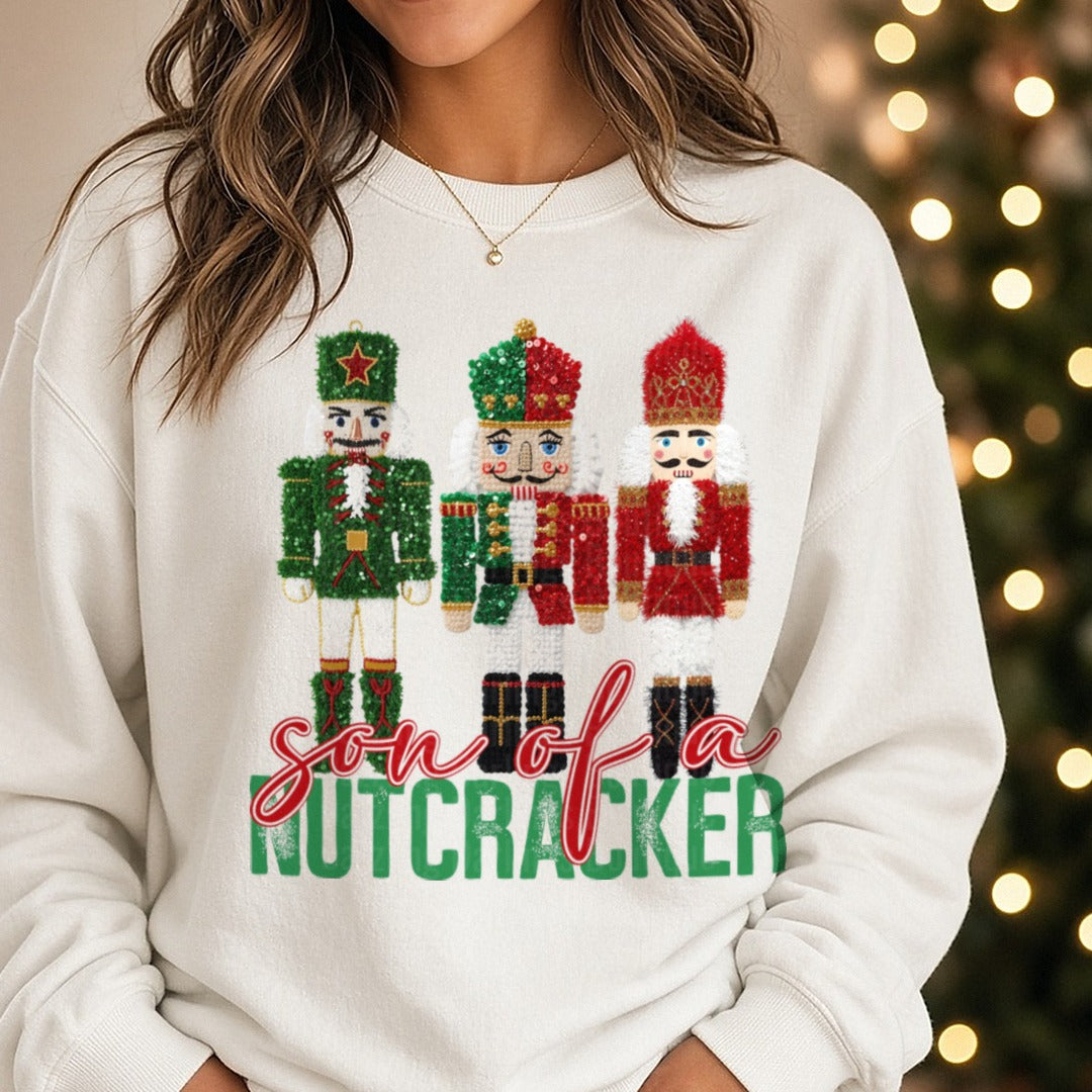 Son of a Nutcracker DTF transfer shown on a Comfort Colors sweatshirt