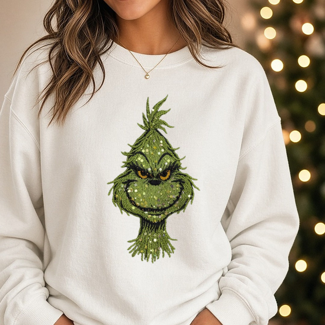 Christmas Yarn Sequins Face DTF transfer shown on a Comfort Colors sweatshirt