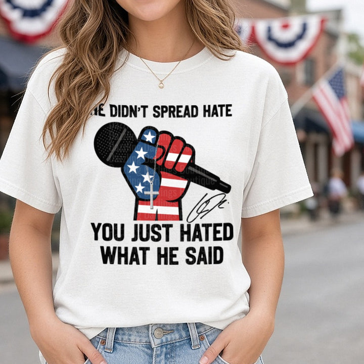 Charlie Kirk He Didn't Spread Hate Flag Fist Microphone DTF transfer shown on a Comfort Colors tee