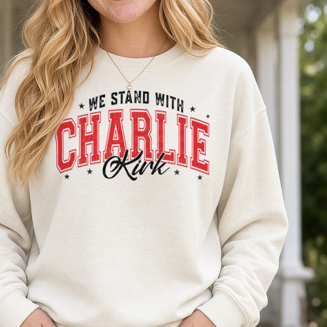 We Stand With Charlie Kirk Red Varsity DTF transfer shown on a Comfort Colors sweatshirt