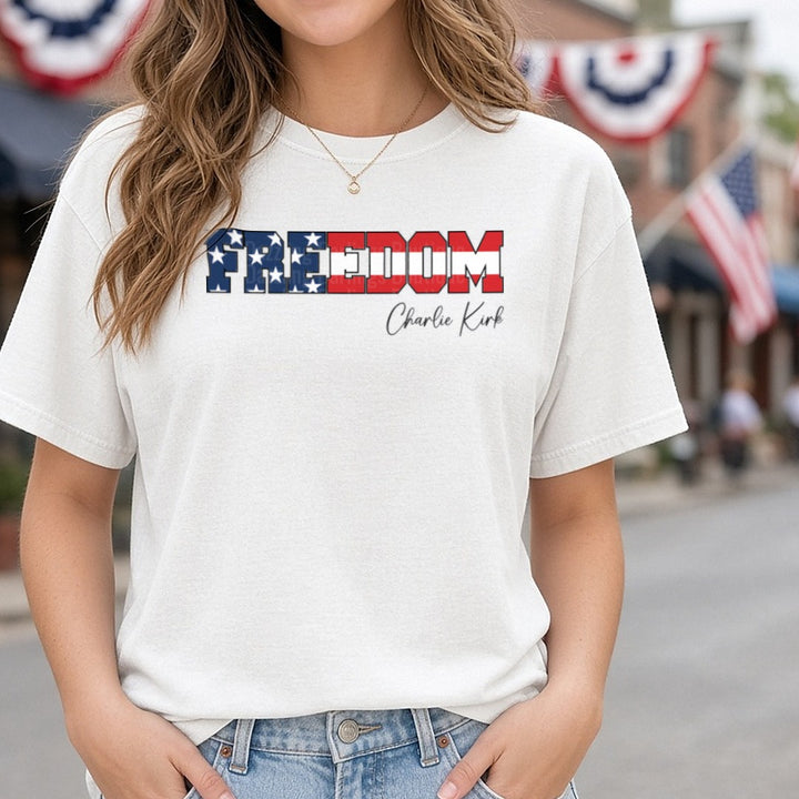 Freedom Flag Letters Charlie Kirk Script DTF transfer shown on a Comfort Colors tee