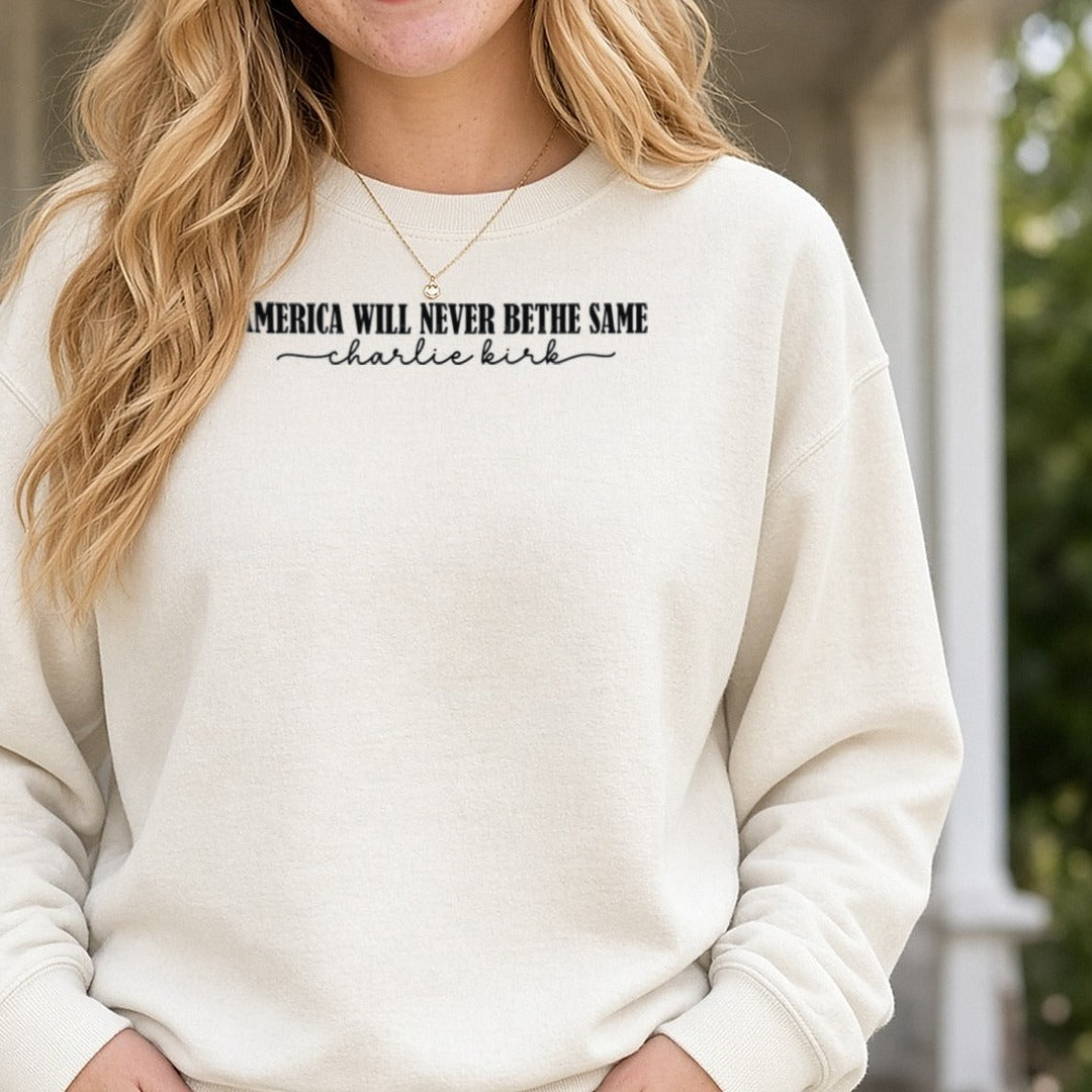 America Will Never Be The Same Charlie Kirk Serif DTF transfer shown on a Comfort Colors sweatshirt