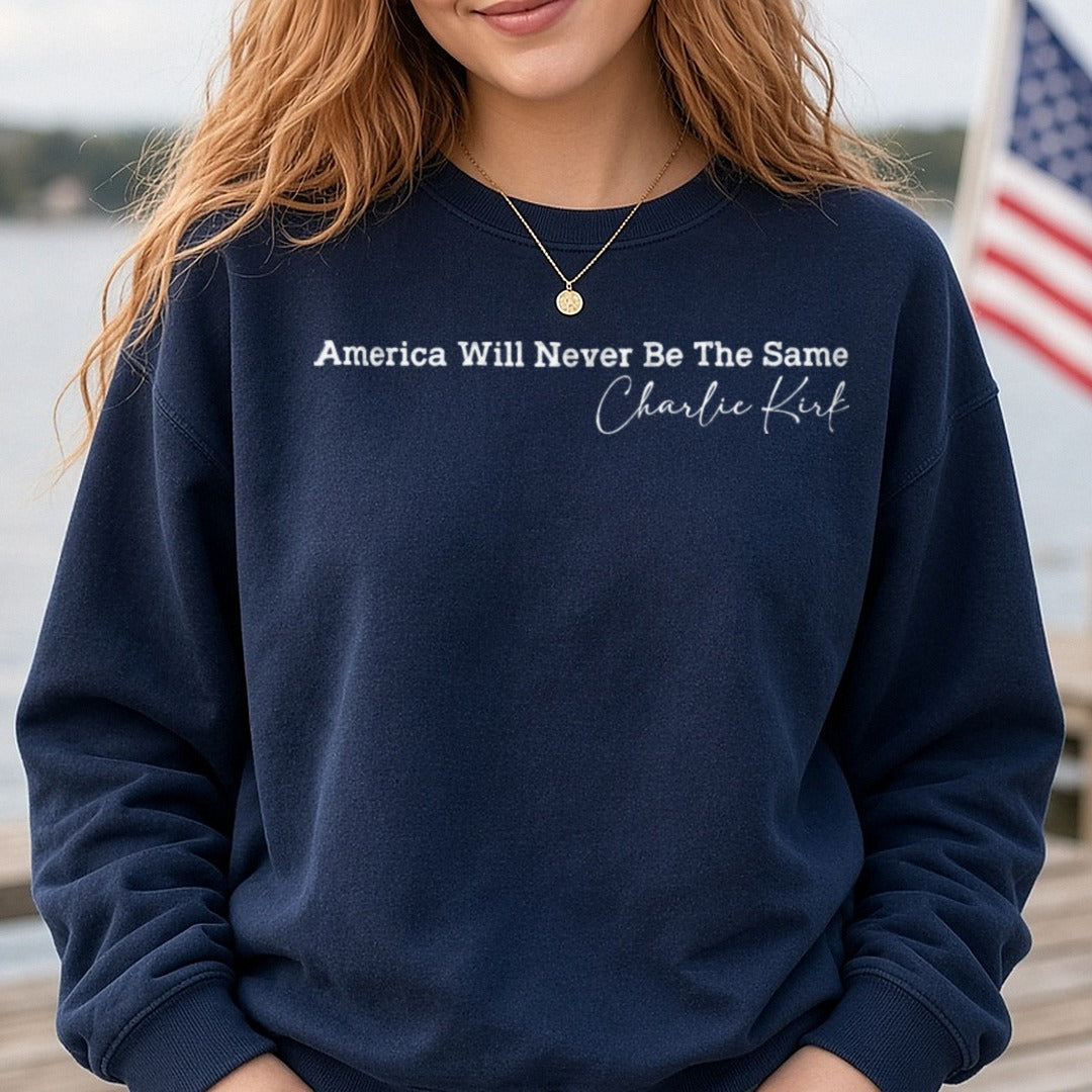 America Will Never Be The Same Charlie Kirk White Text DTF transfer shown on a Comfort Colors sweatshirt
