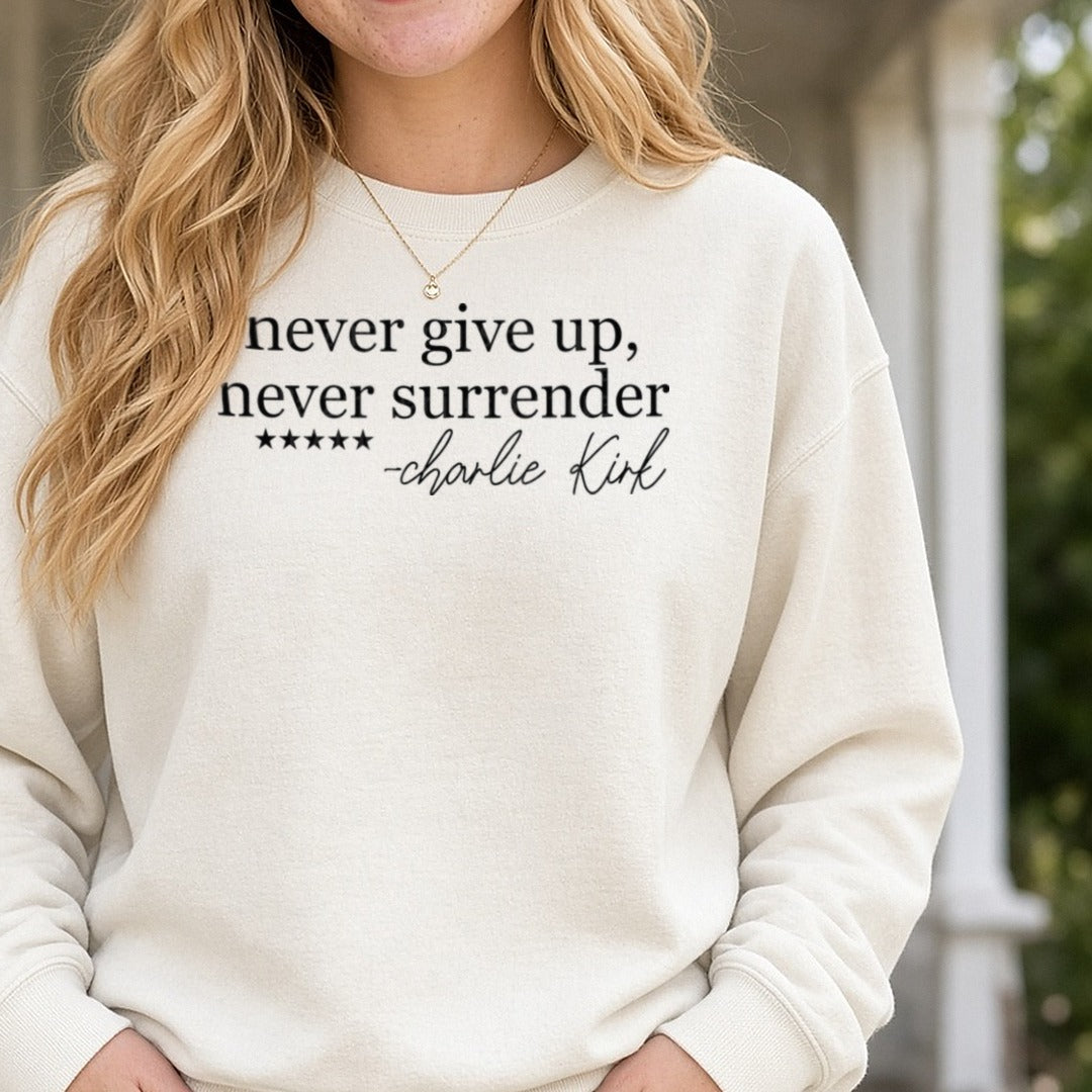 Never Give up, Never Surrender -Charlie Kirk DTF transfer shown on a Comfort Colors sweatshirt