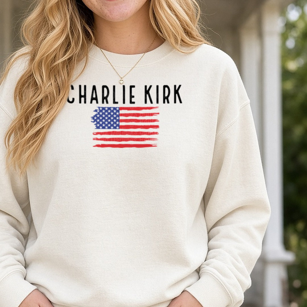 Charlie Kirk Black Letters Distressed Flag DTF transfer shown on a Comfort Colors sweatshirt