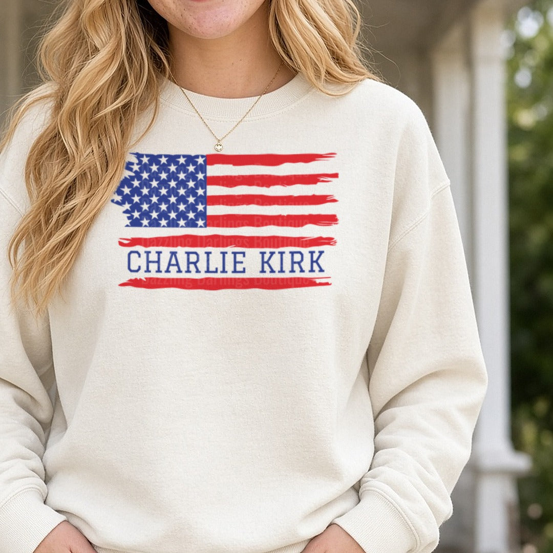 Charlie Kirk Distressed Flag Blue Banner DTF transfer shown on a Comfort Colors sweatshirt