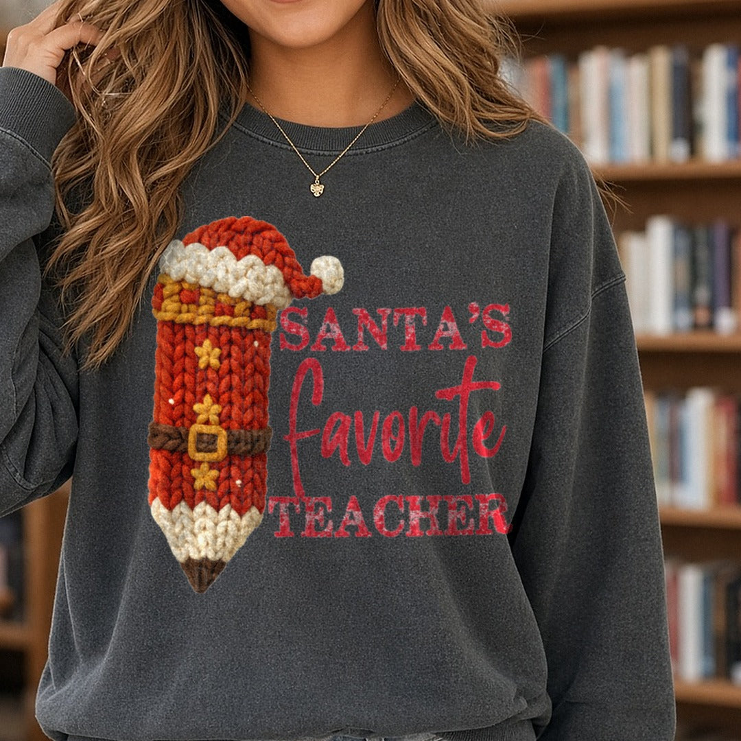 Santas Favorite Teacher DTF transfer shown on a Comfort Colors sweatshirt