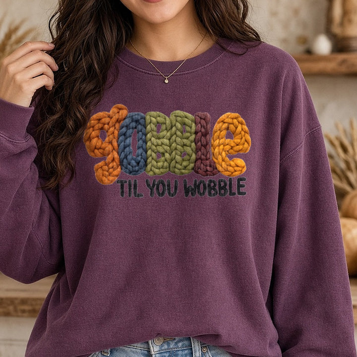 Gobble Til You Wobble Yarn DTF transfer shown on a Comfort Colors sweatshirt