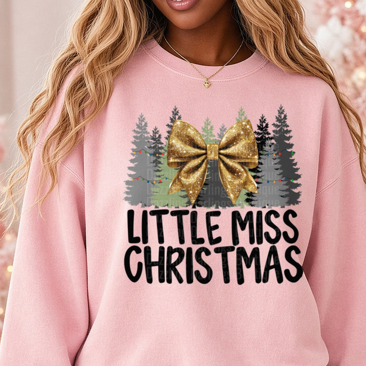 Gold Bow Little Miss Christmas DTF transfer shown on a Comfort Colors sweatshirt