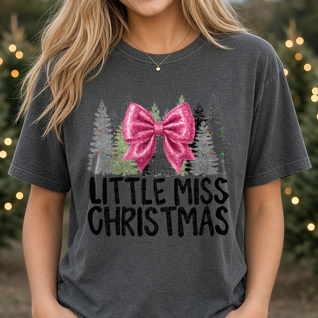 Pink Bow Little Miss Christmas DTF transfer shown on a Comfort Colors tee