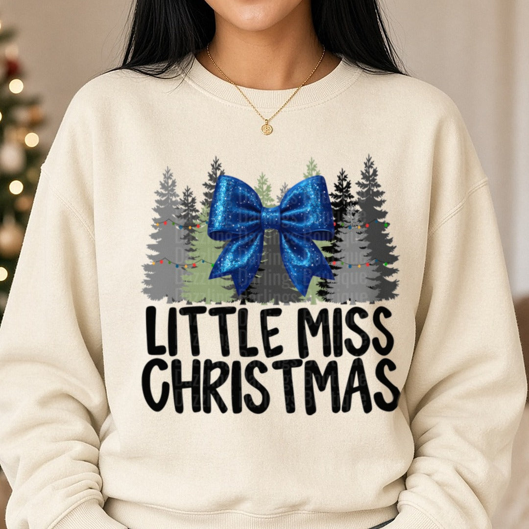 Blue Bow Little Miss Christmas DTF transfer shown on a Comfort Colors sweatshirt