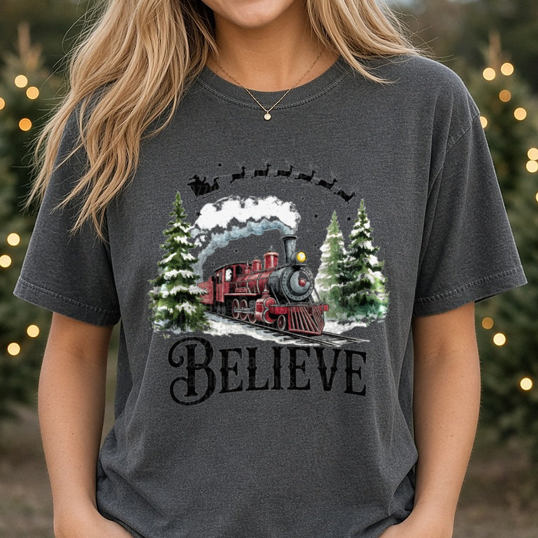 Believe North Pole Train Christmas Train DTF transfer shown on a Comfort Colors tee