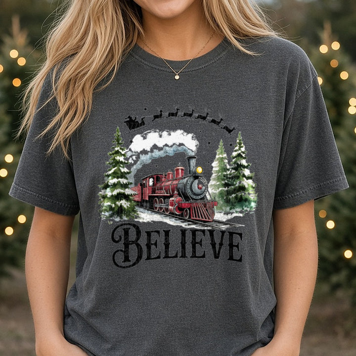 Believe North Pole Train Christmas Train DTF transfer shown on a Comfort Colors tee