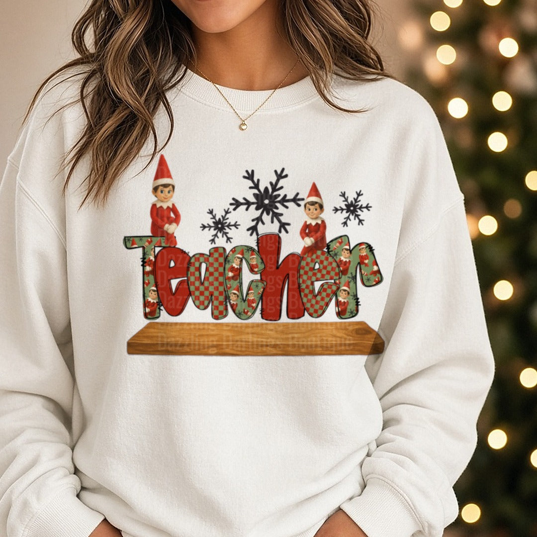Teacher Elf Christmas DTF transfer shown on a Comfort Colors sweatshirt
