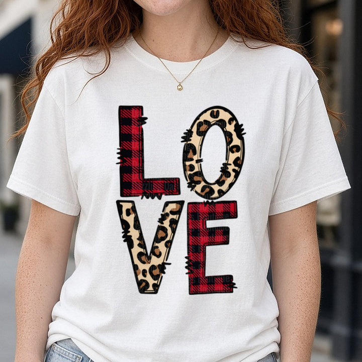 LOVE Buffalo Plaid Leopard Letters Valentine DTF transfer shown on a Comfort Colors tee