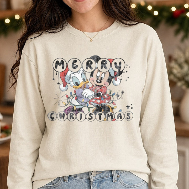 Merry Christmas Minnie and daisy DTF transfer shown on a Comfort Colors long sleeve tee