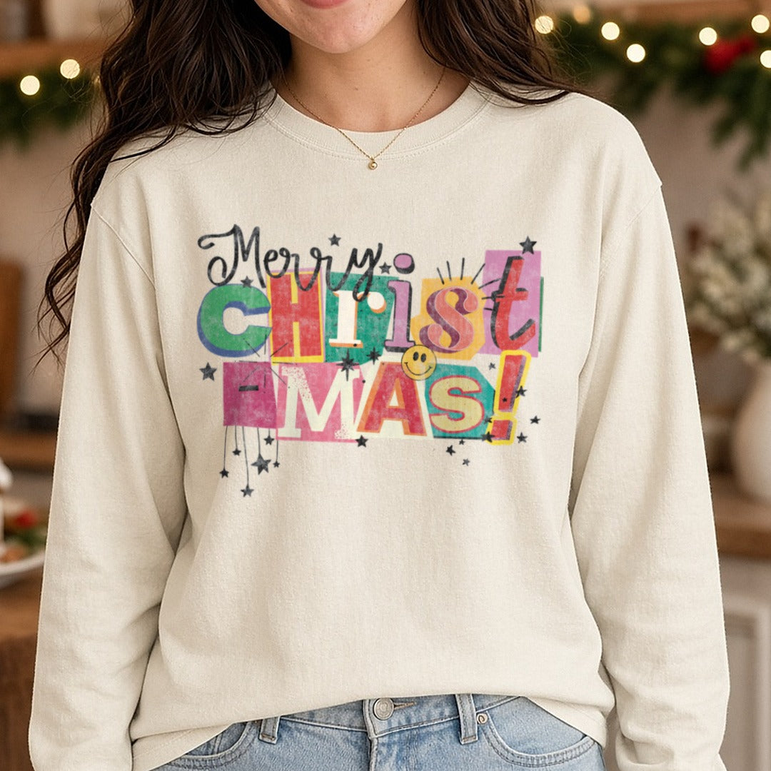 Merry Christmas magazine cut out DTF transfer shown on a Comfort Colors long sleeve tee