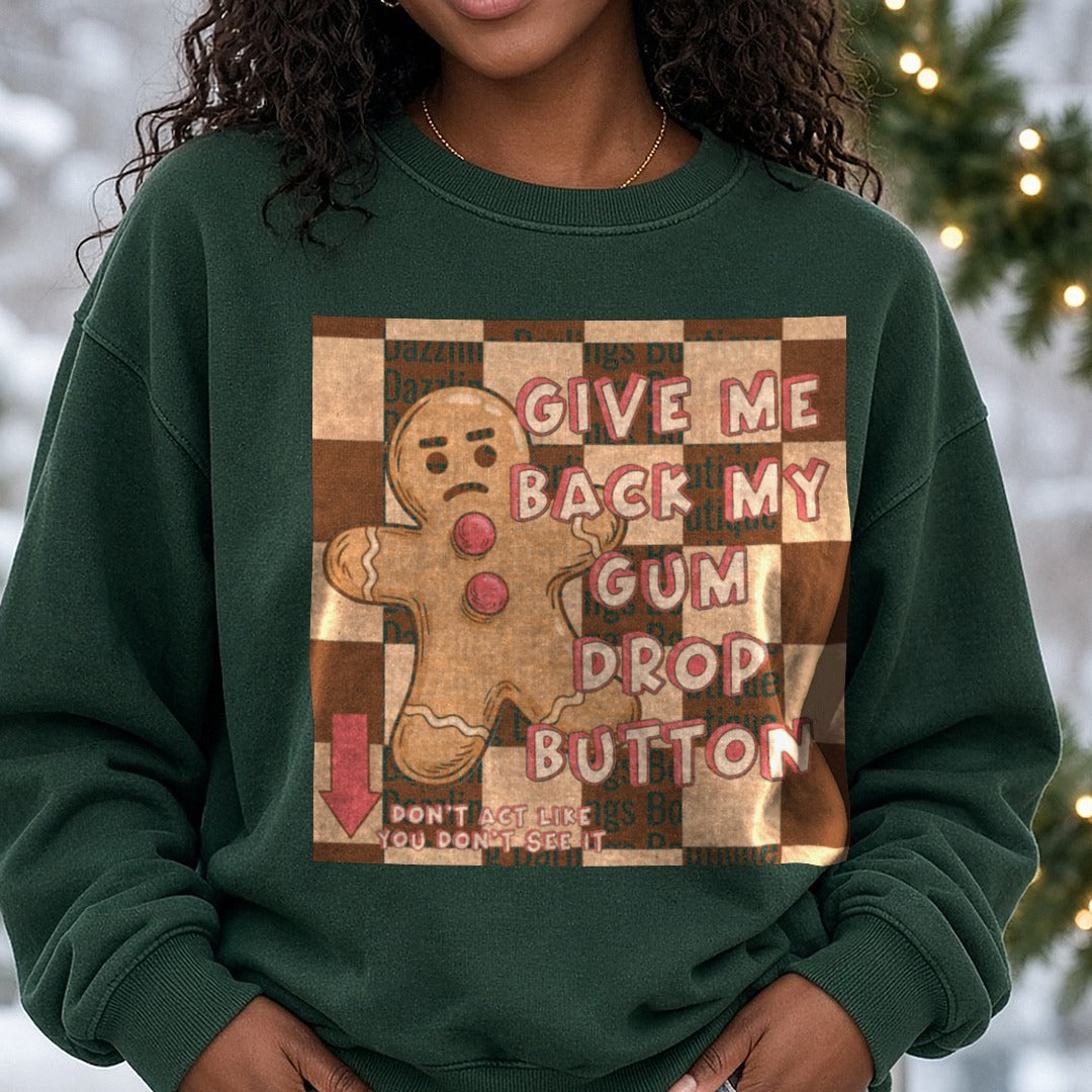 Give Me Back My Gum Drop Button Gingerbread Man DTF transfer shown on a Comfort Colors sweatshirt