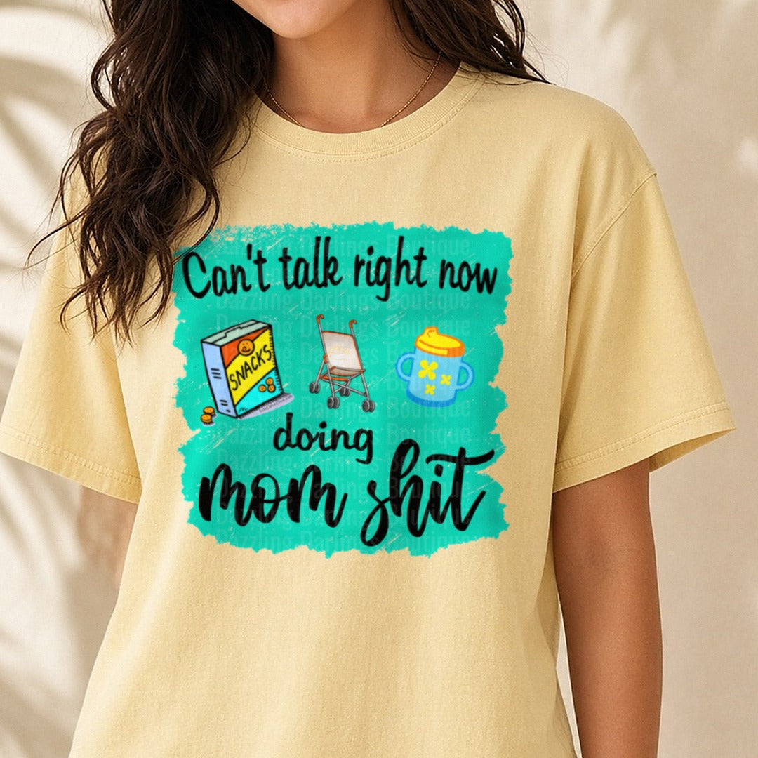Can't Talk Right Now Doing Mom Sh*t Snacks Stroller DTF transfer shown on a Comfort Colors tee