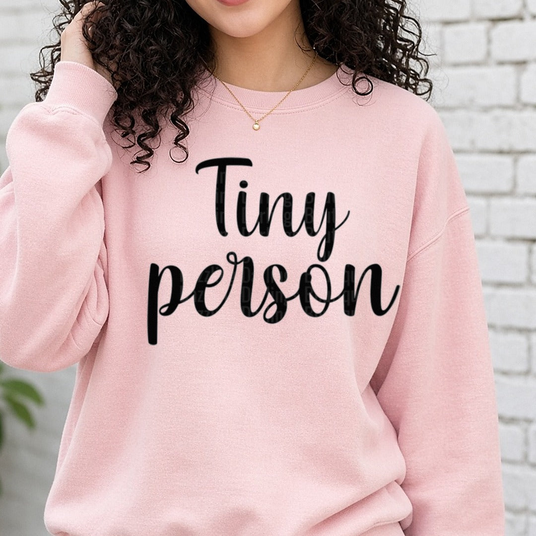 Tiny Person Script Black DTF transfer shown on a Comfort Colors sweatshirt