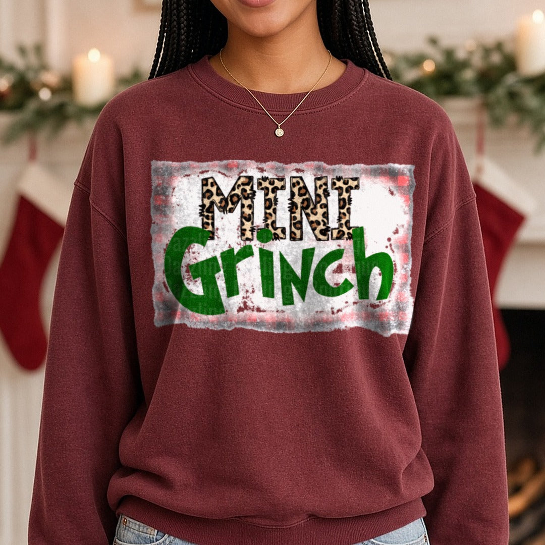 Mini Grinch Leopard Christmas DTF transfer shown on a Comfort Colors sweatshirt