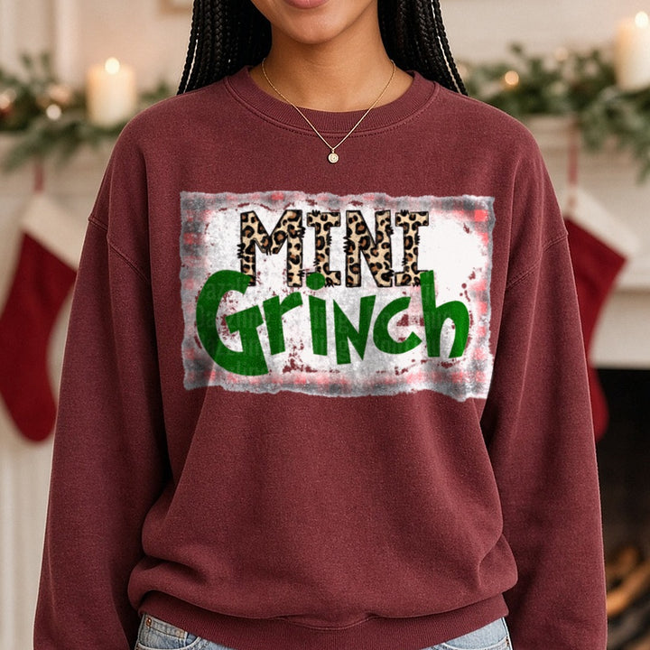 Mini Grinch Leopard Christmas DTF transfer shown on a Comfort Colors sweatshirt