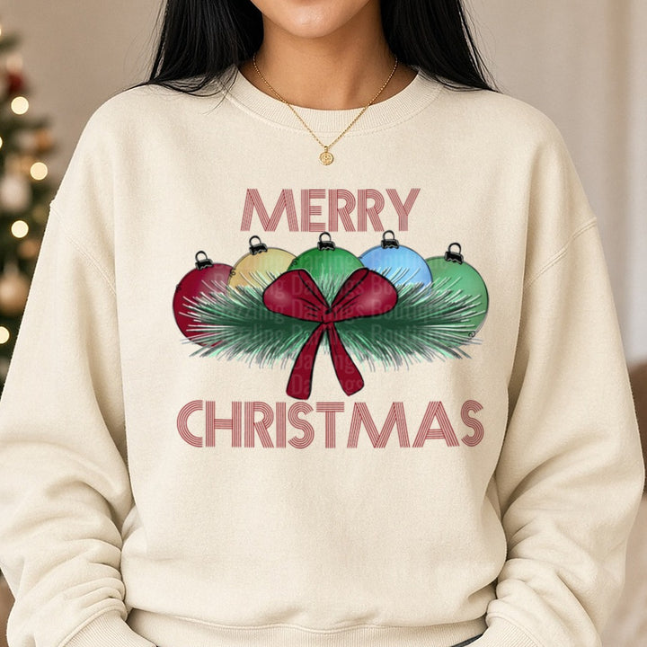 Merry Christmas Red Bow Pine Bulbs DTF transfer shown on a Comfort Colors sweatshirt
