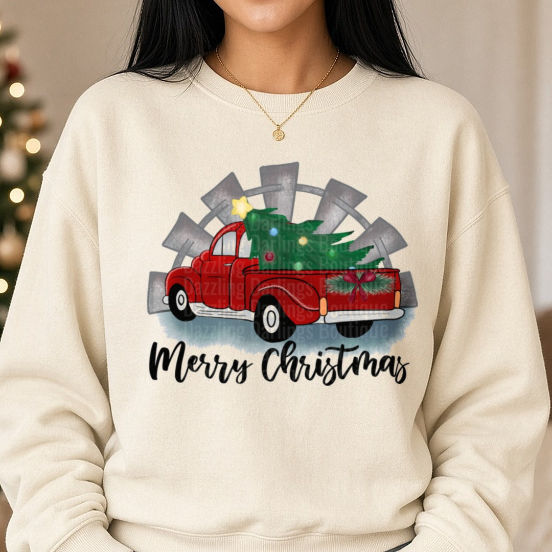 Merry Christmas Red Truck Windmill Christmas Tree DTF transfer shown on a Comfort Colors sweatshirt
