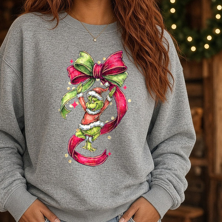 Bow grinch DTF transfer shown on a Comfort Colors sweatshirt