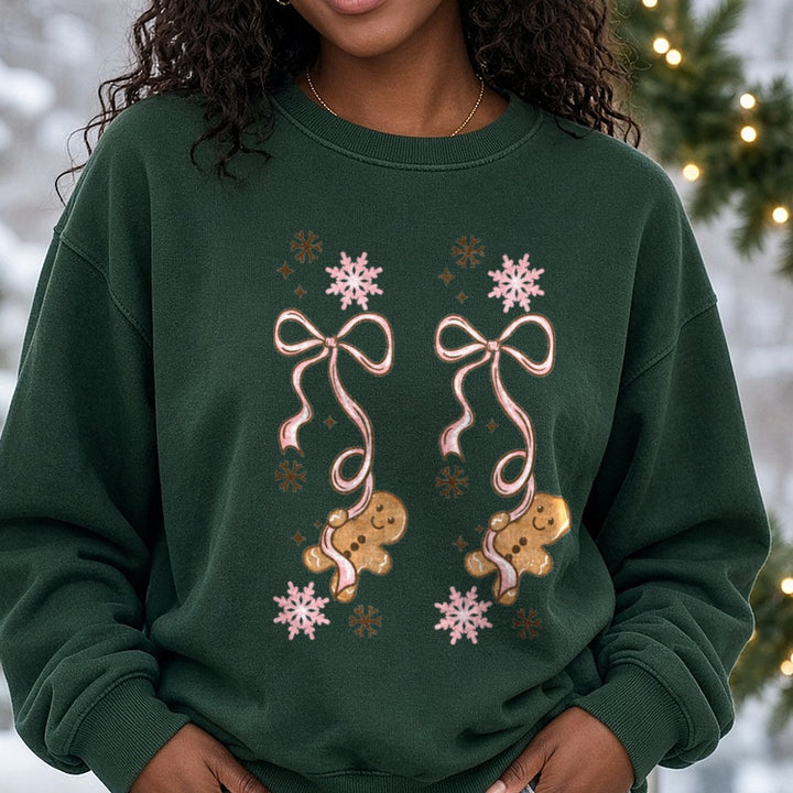 Gingerbread Bow Coffee Sleeve DTF transfer shown on a Comfort Colors sweatshirt
