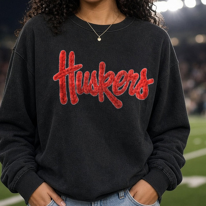Huskers DTF transfer shown on a Comfort Colors sweatshirt