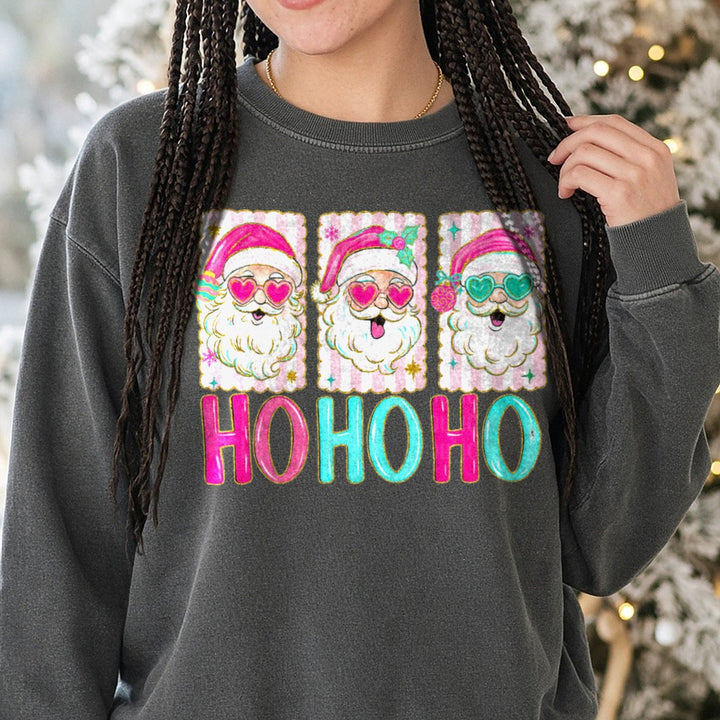 Ho Ho Ho Pink Santa Heart Sunglasses Trio DTF transfer shown on a Comfort Colors sweatshirt