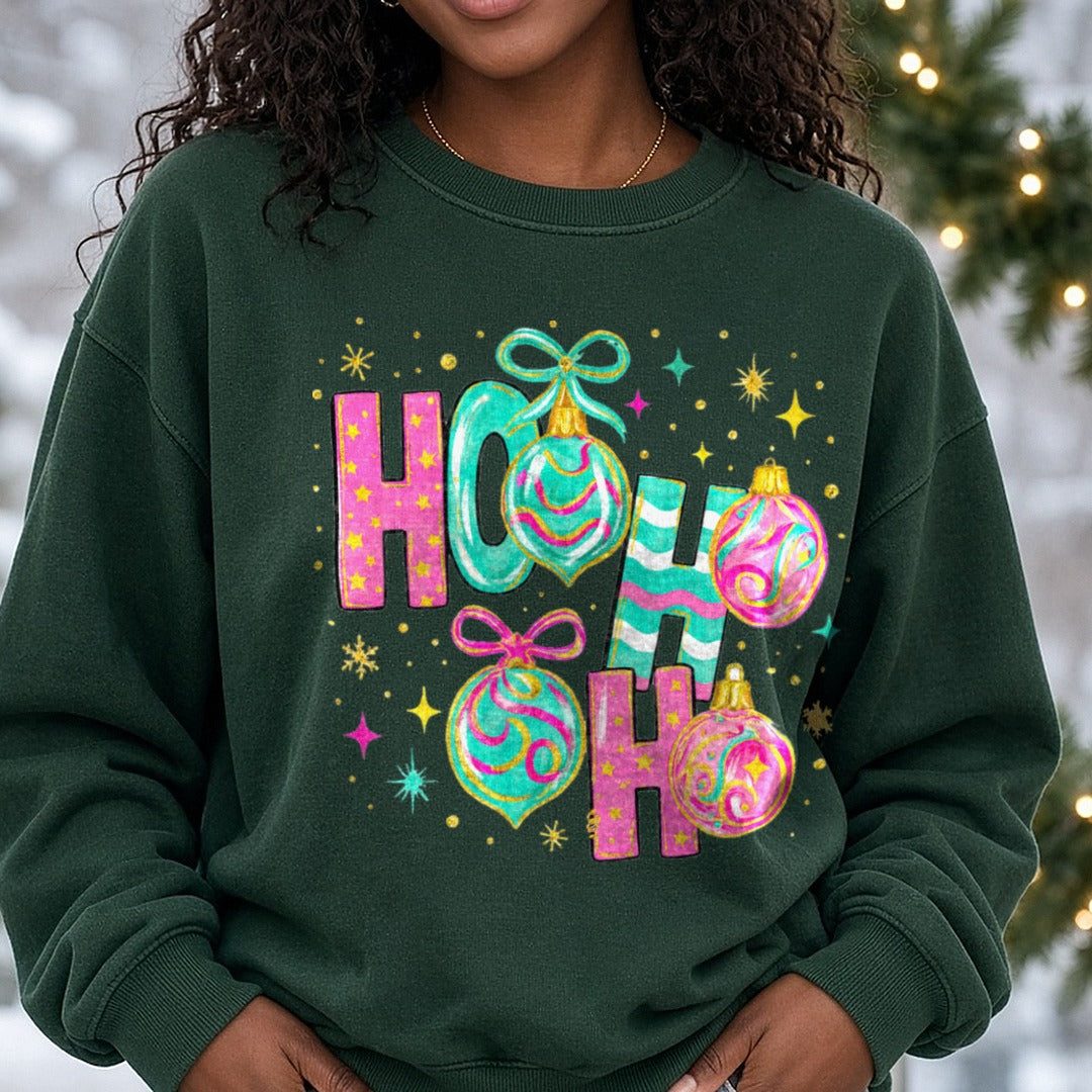 Ho Ho Ho Pink & Teal Christmas Ornaments DTF transfer shown on a Comfort Colors sweatshirt