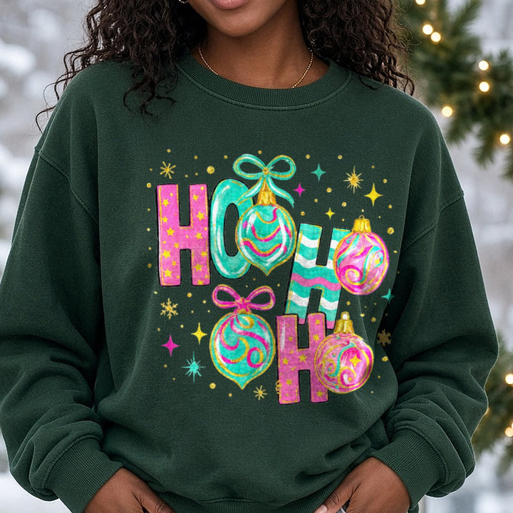 Ho Ho Ho Pink & Teal Christmas Ornaments DTF transfer shown on a Comfort Colors sweatshirt