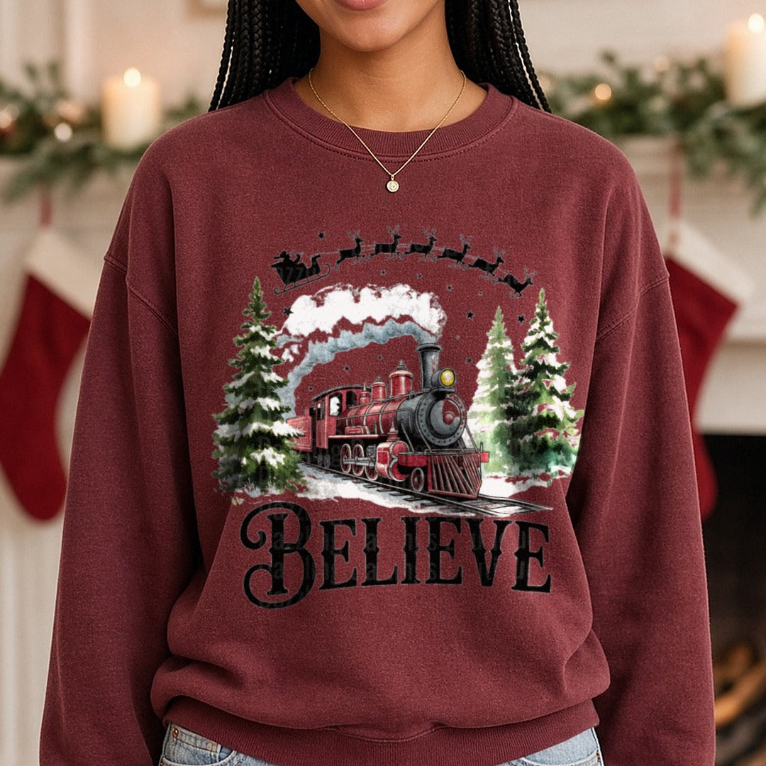 Believe North Pole Train Png, Christmas Train DTF transfer shown on a Comfort Colors sweatshirt