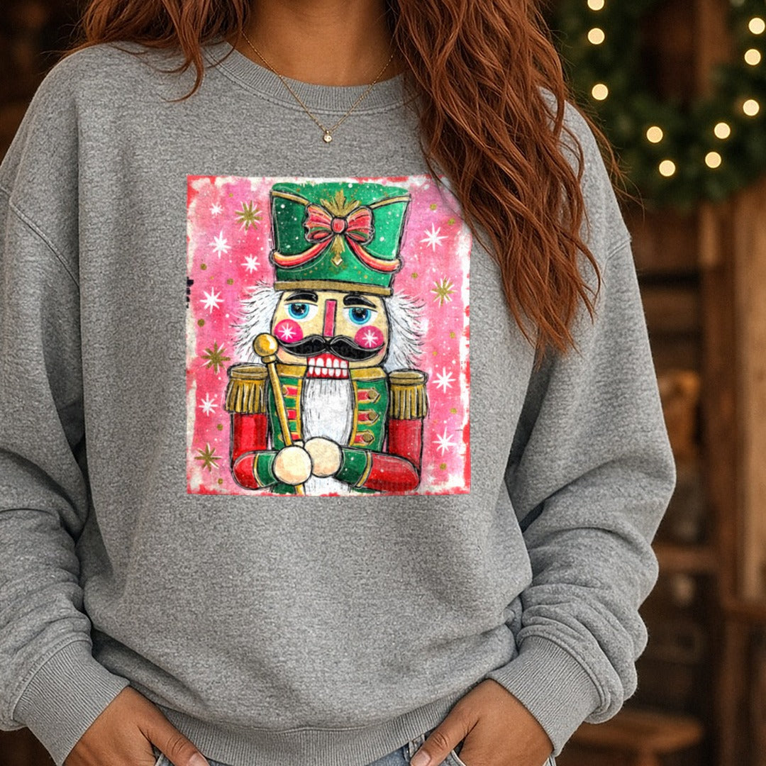 Preppy Brushstroke Glitter Nutcracker DTF transfer shown on a Comfort Colors sweatshirt