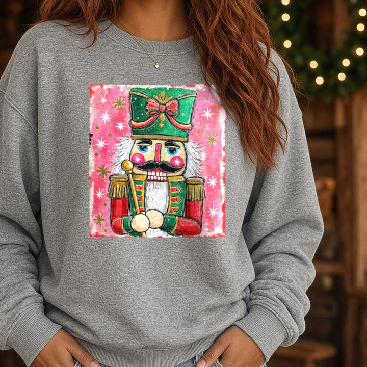 Preppy Brushstroke Glitter Nutcracker DTF transfer shown on a Comfort Colors sweatshirt