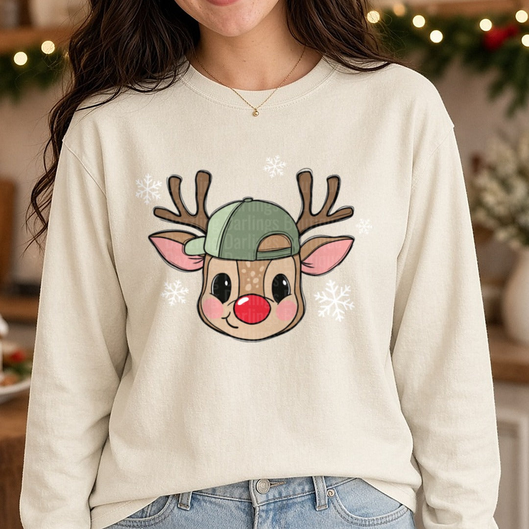 Boy Reindeer Green Cap White Snowflakes DTF transfer shown on a Comfort Colors long sleeve tee