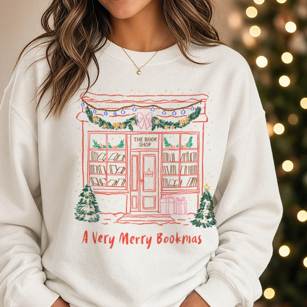 A VERY MERRY BOOKMAS Christmas Book DTF transfer shown on a Comfort Colors sweatshirt