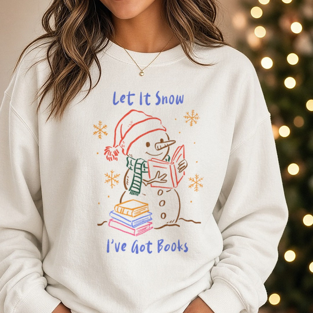 LET IT SNOW I'VE GOT BOOKS Christmas Book DTF transfer shown on a Comfort Colors sweatshirt
