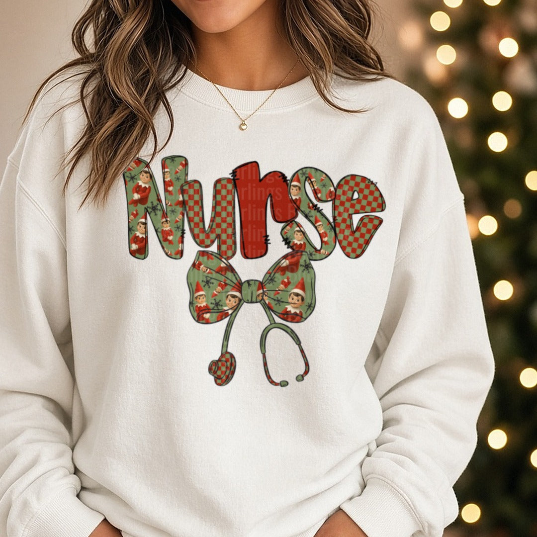 Nurse Christmas Vintage Floral Letters Bow Stethoscope DTF transfer shown on a Comfort Colors sweatshirt