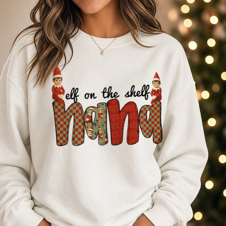 Nana Christmas Elves Checkered Letters DTF transfer shown on a Comfort Colors sweatshirt