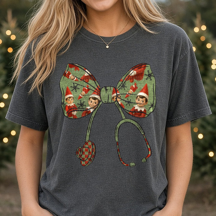 Elf bow DTF transfer shown on a Comfort Colors tee