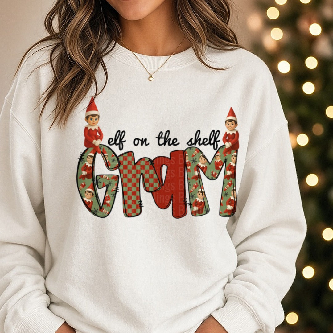 Gram Christmas Elves Checkered Letters DTF transfer shown on a Comfort Colors sweatshirt