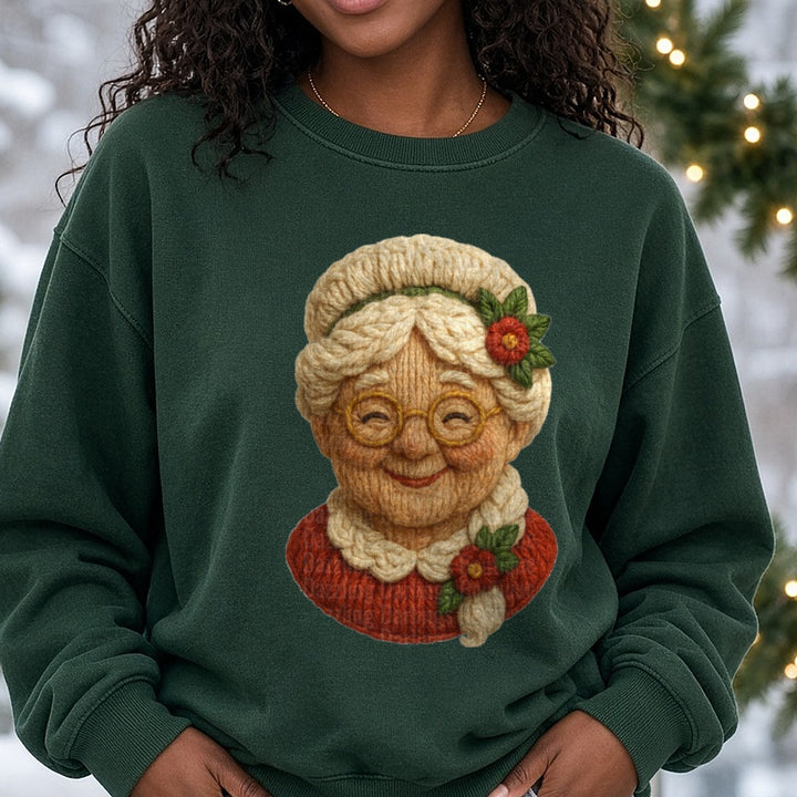Yarn Mrs claus DTF transfer shown on a Comfort Colors sweatshirt