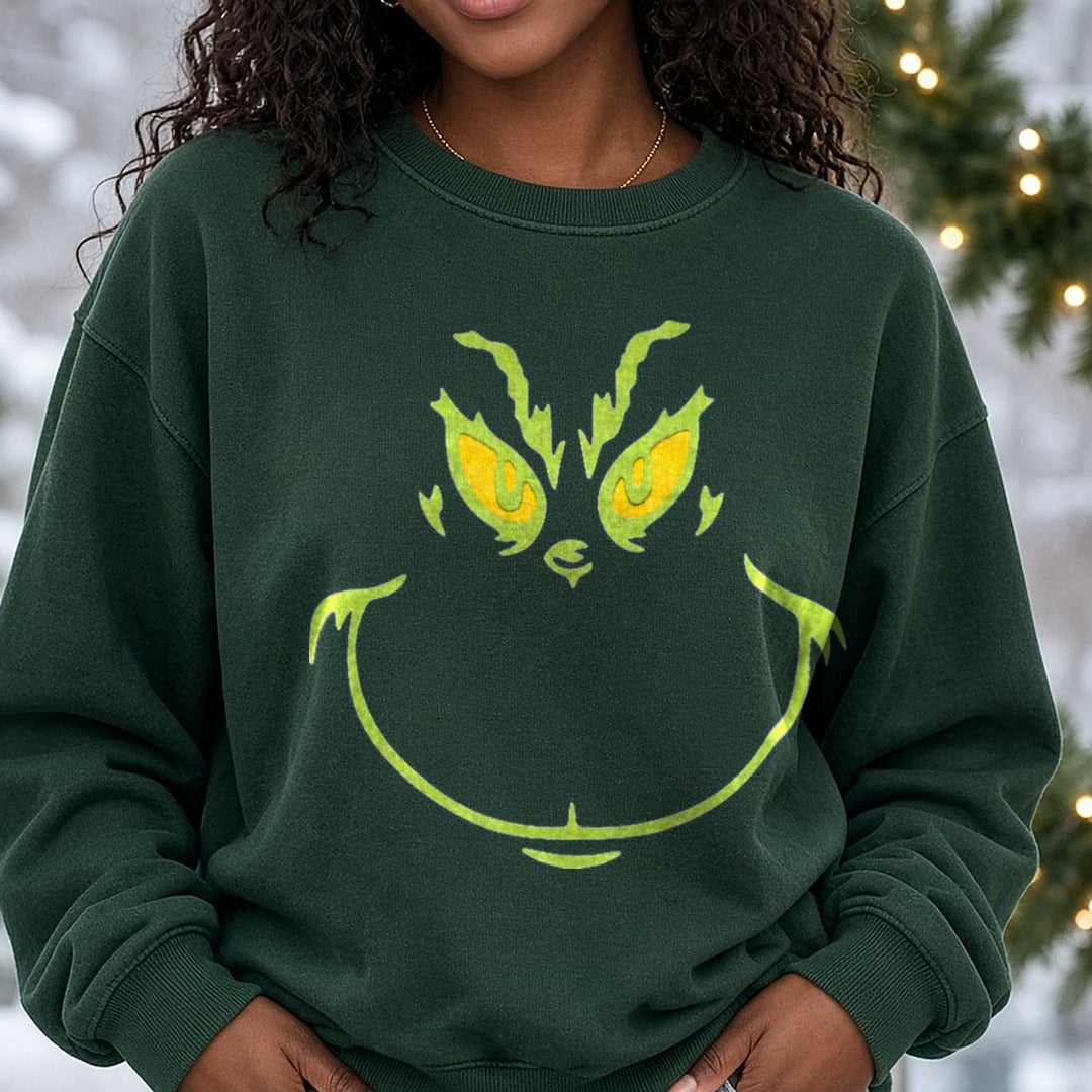 grinch face DTF transfer shown on a Comfort Colors sweatshirt