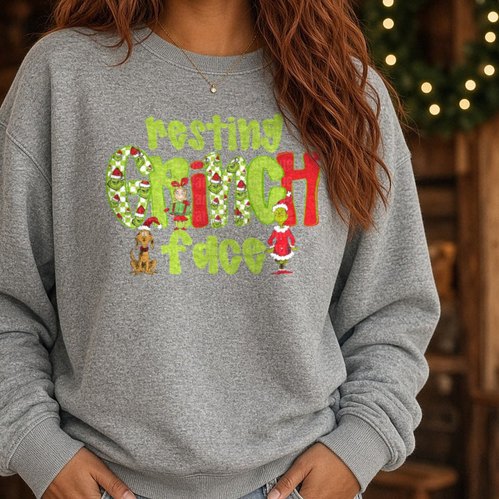 resting grinch DTF transfer shown on a Comfort Colors sweatshirt