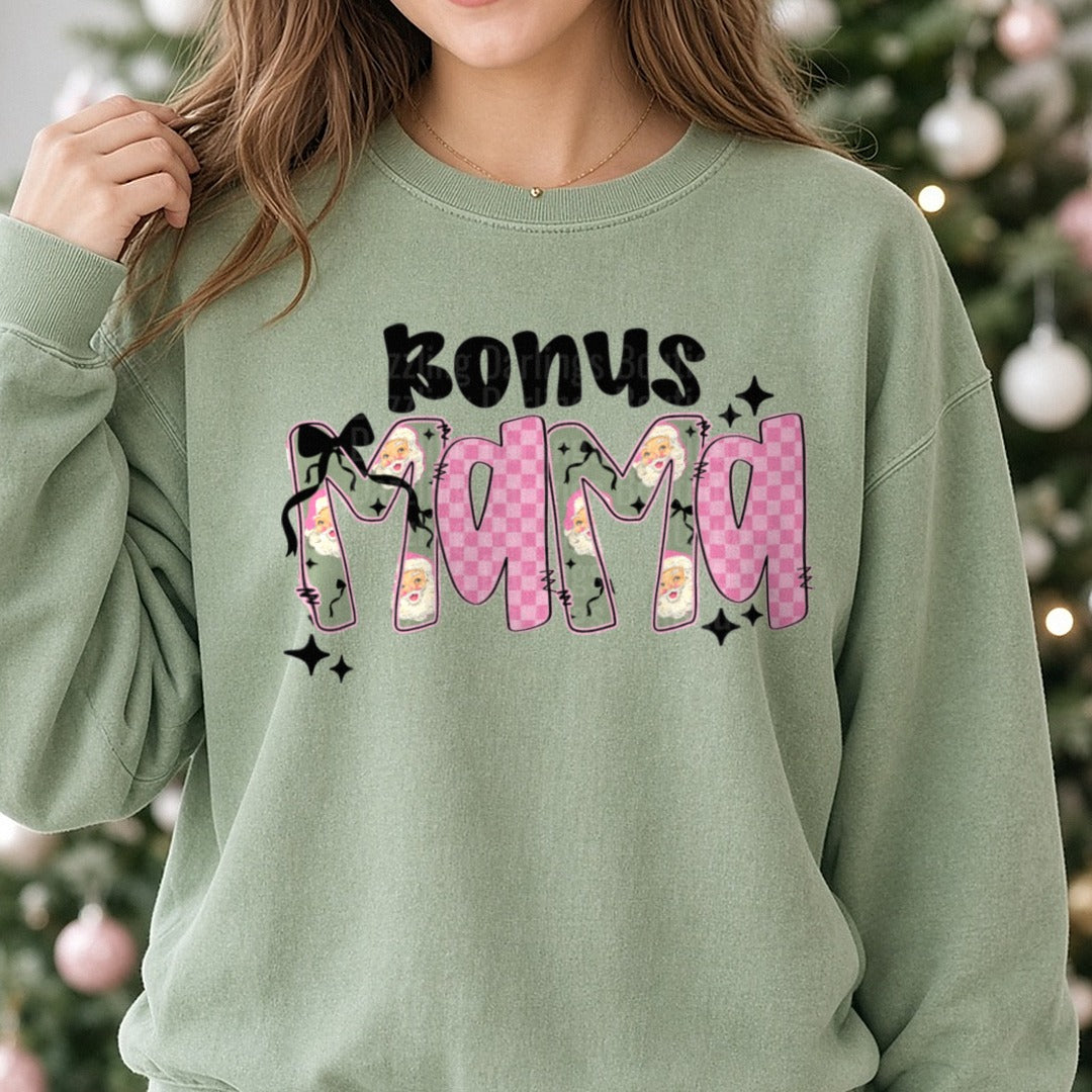 Bonus Mama Pink Checkered Santa Letters Bow DTF transfer shown on a Comfort Colors sweatshirt